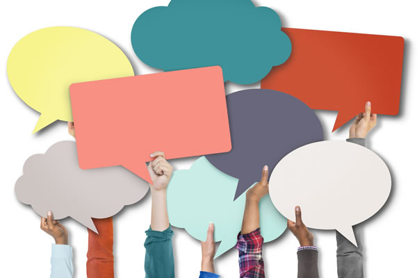 hands holding multi-colored placards depicting ideas and thoughts